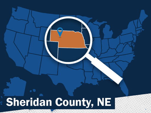 blue map of the U. S. with magnifying glass highlighting nebraska with a location marker over the Sheridan County area